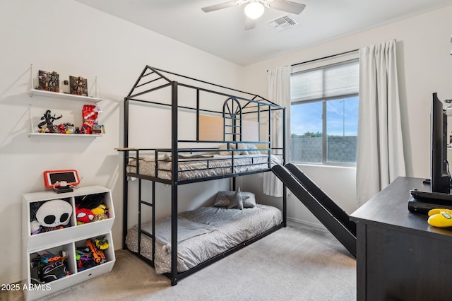 carpeted bedroom with baseboards and visible vents