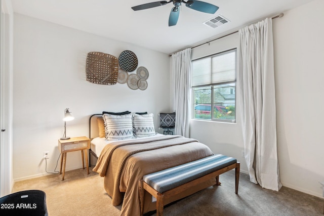 bedroom featuring visible vents, carpet floors, baseboards, and ceiling fan