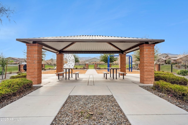 view of home's community featuring a gazebo and fence