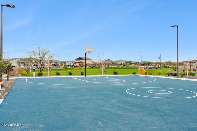 view of sport court featuring a yard and community basketball court