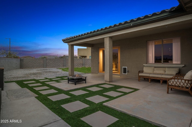 view of patio / terrace with a fenced backyard and an outdoor fire pit