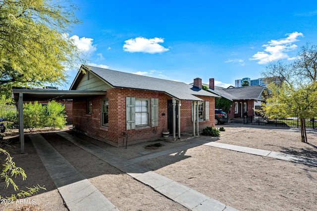 view of front of home with a carport