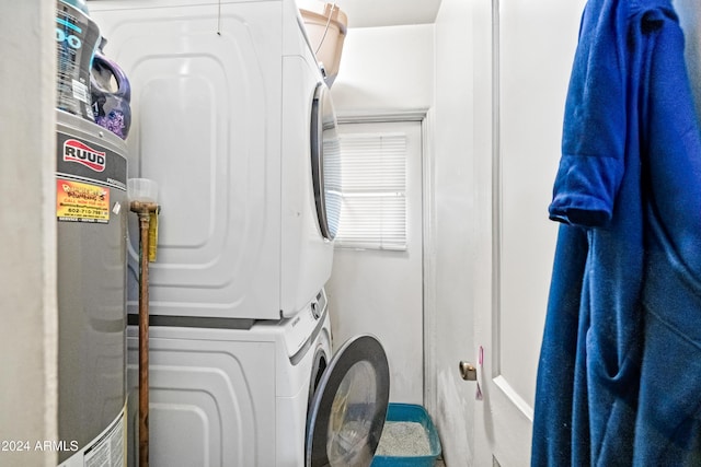 laundry room with stacked washing maching and dryer