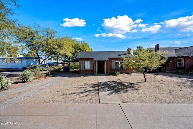 single story home with a carport