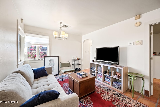 living room with an inviting chandelier