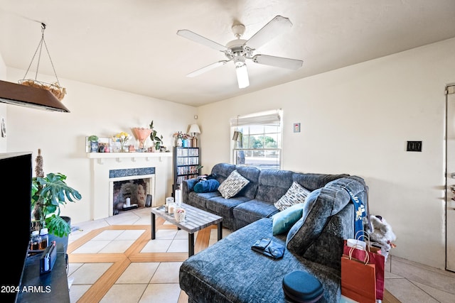 living room with ceiling fan and light tile patterned flooring