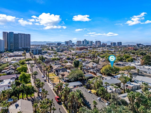 birds eye view of property with a mountain view