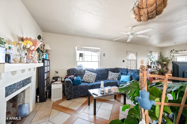 tiled living room with ceiling fan