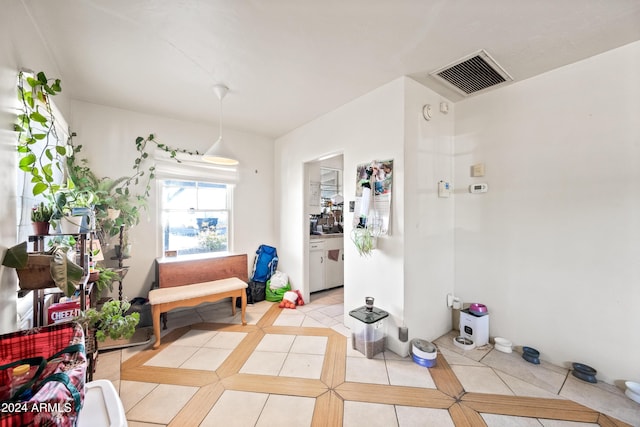 sitting room with light tile patterned floors