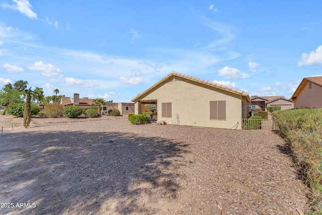 22609 S 214th Way, Queen Creek, AZ 85142 - rear view of house featuring a tiled roof and stucco siding