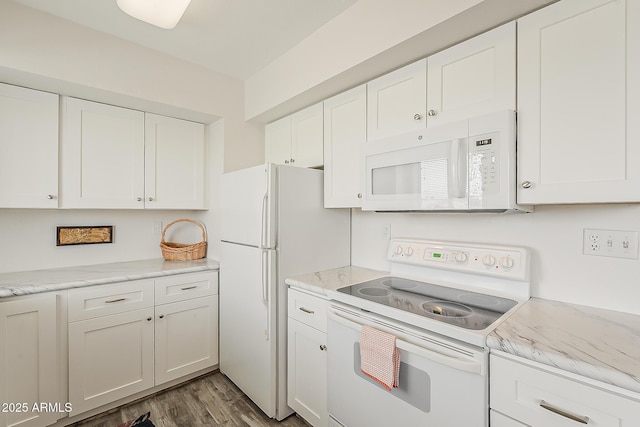 4554 E Paradise Village Pkwy N Unit 249, Phoenix, AZ 85032 - kitchen featuring white cabinets, wood finished floors, and white appliances