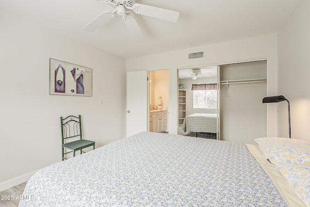 4554 E Paradise Village Pkwy N Unit 249, Phoenix, AZ 85032 - bedroom featuring a closet, light wood-style flooring, visible vents, baseboards, and ceiling fan