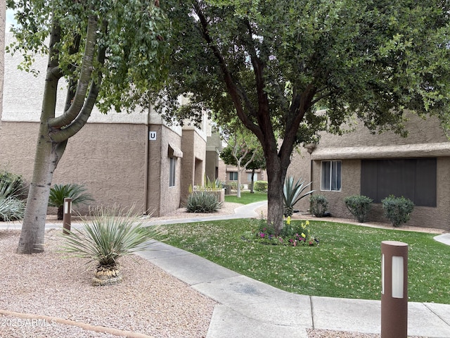 4554 E Paradise Village Pkwy N Unit 249, Phoenix, AZ 85032 - view of community with a yard