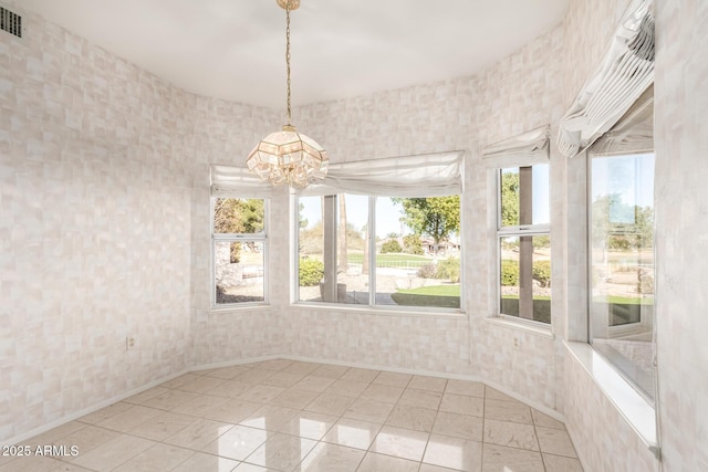 interior space with a chandelier and tile patterned flooring