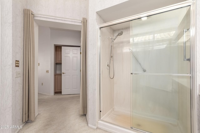 bathroom with a shower with shower door