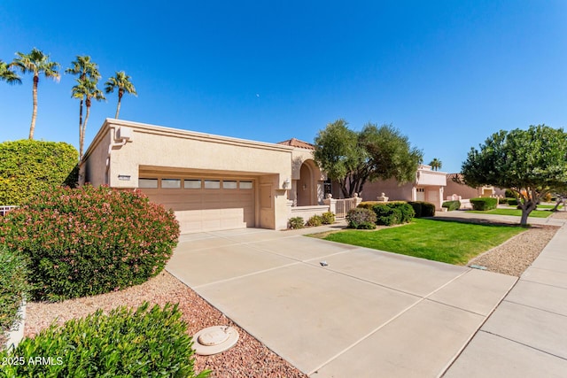 view of front of house with a garage and a front yard