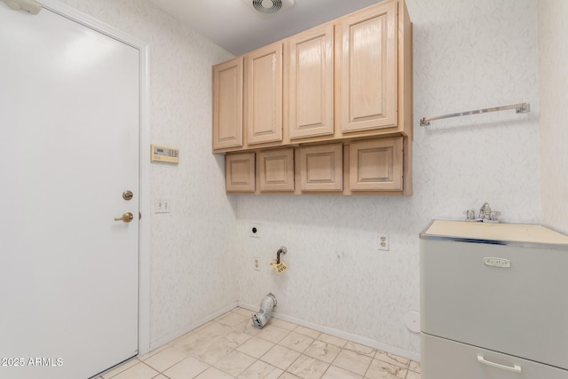 washroom with hookup for a gas dryer, cabinets, and hookup for an electric dryer