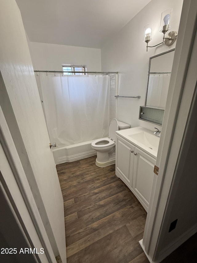5517 E Boise St, Mesa, AZ 85205 - full bathroom with vanity, toilet, shower / tub combo, and wood finished floors
