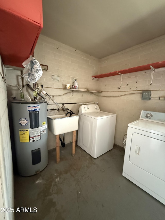 5517 E Boise St, Mesa, AZ 85205 - laundry room featuring electric water heater, washing machine and clothes dryer, and concrete block wall