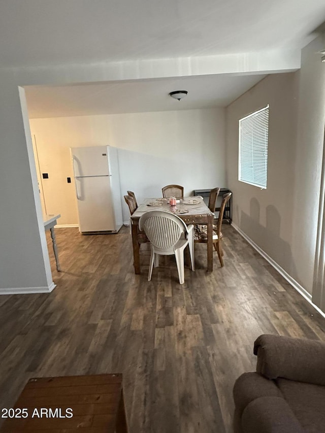 5517 E Boise St, Mesa, AZ 85205 - dining room featuring dark wood-type flooring and baseboards