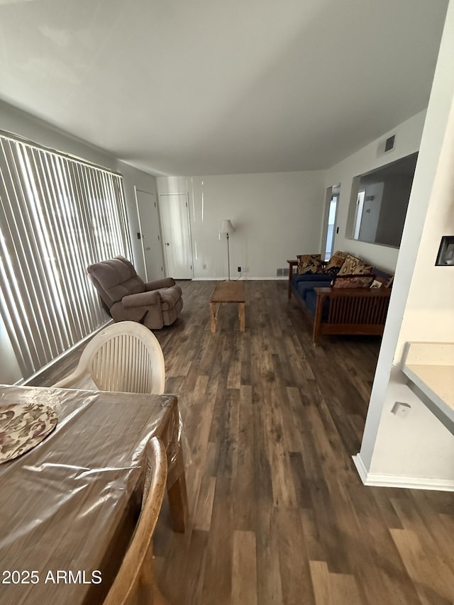 5517 E Boise St, Mesa, AZ 85205 - living room featuring dark wood-type flooring and baseboards