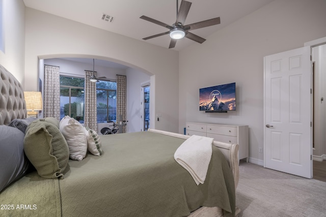 bedroom featuring light carpet and ceiling fan