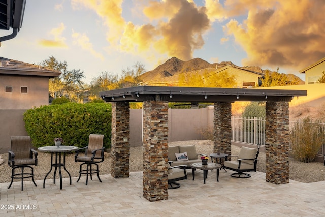 patio terrace at dusk with a mountain view