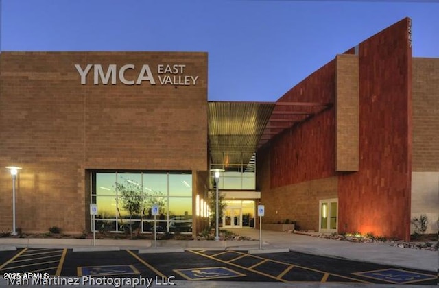 view of outdoor building at dusk