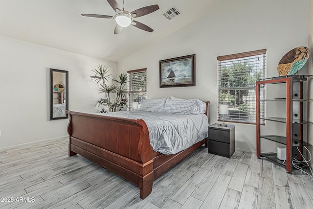 bedroom featuring ceiling fan, vaulted ceiling, wood finished floors, and visible vents