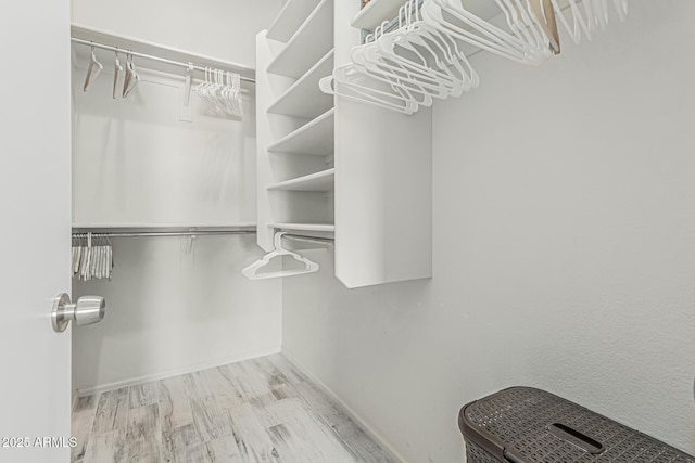 spacious closet featuring wood finished floors