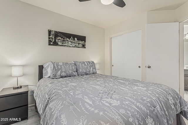 bedroom with a ceiling fan and wood finished floors
