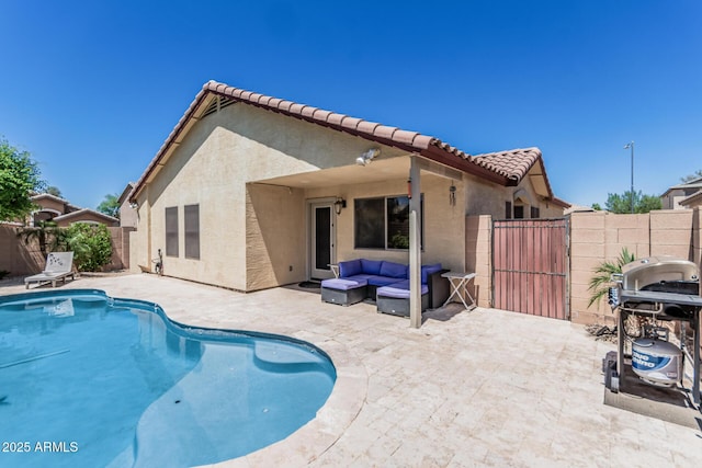 view of swimming pool with an outdoor living space, a gate, a patio area, a fenced in pool, and a fenced backyard