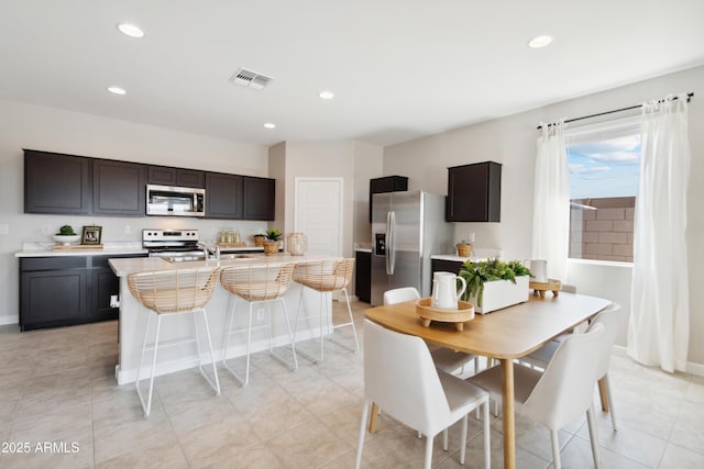 tiled dining area featuring sink