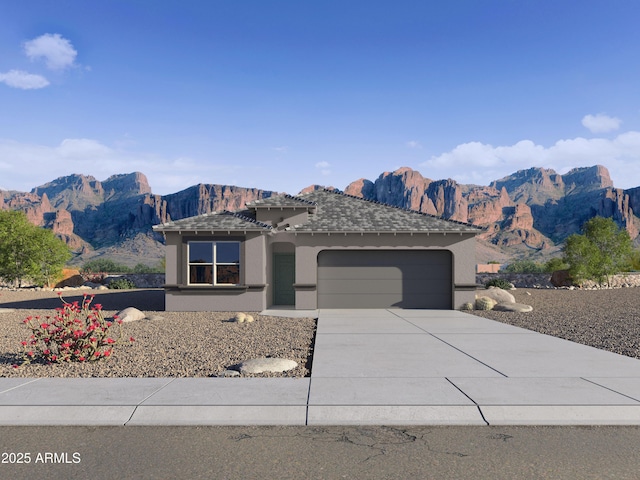 view of front of house with a garage and a mountain view