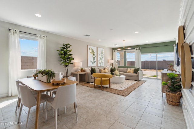 dining room featuring light tile patterned floors and plenty of natural light