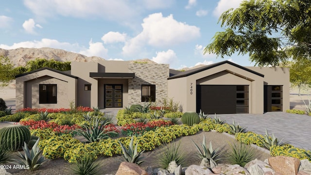 view of front of house featuring a mountain view and a garage