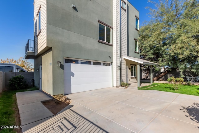 view of side of home featuring a garage