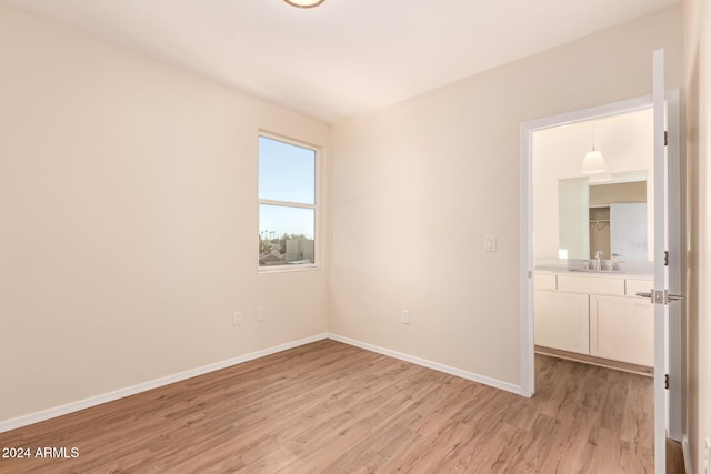 unfurnished room featuring light wood-type flooring