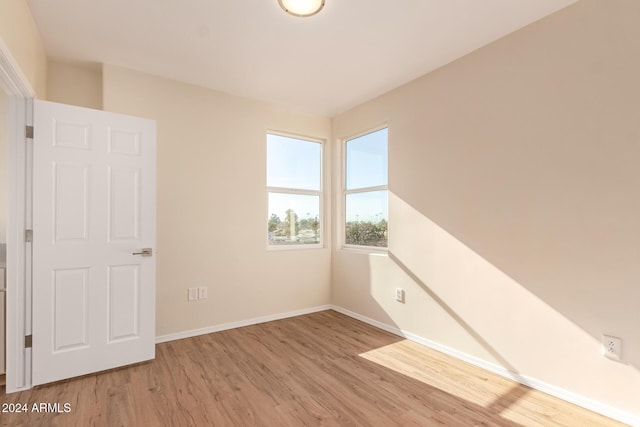 spare room featuring light wood-type flooring