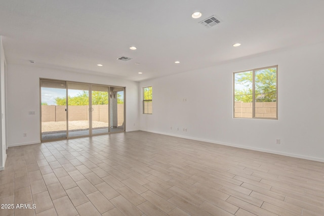 12358 W Marguerite Ave, Avondale, AZ 85323 - unfurnished room featuring baseboards, light wood-style flooring, visible vents, and recessed lighting