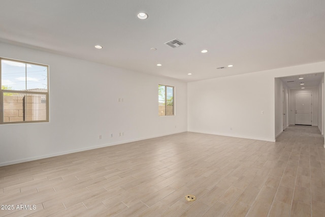 12358 W Marguerite Ave, Avondale, AZ 85323 - spare room with baseboards, light wood-style floors, visible vents, and recessed lighting