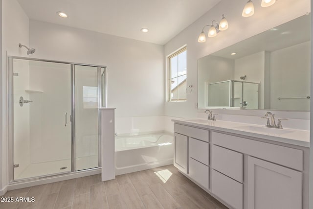 12358 W Marguerite Ave, Avondale, AZ 85323 - bathroom featuring a shower stall, a garden tub, a sink, and double vanity
