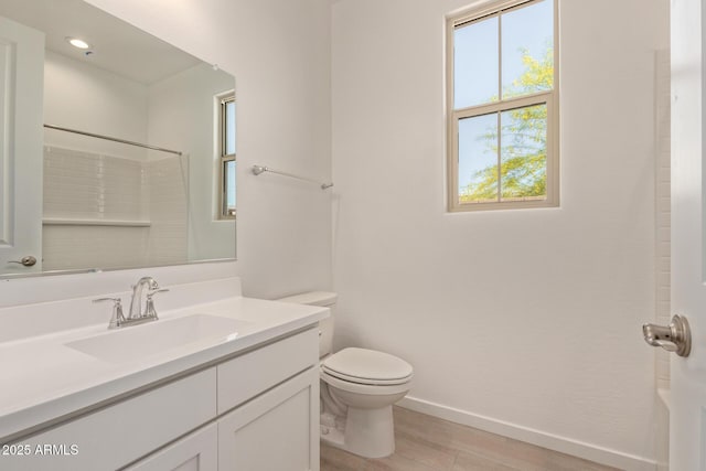 12358 W Marguerite Ave, Avondale, AZ 85323 - bathroom with wood finished floors, toilet, vanity, and plenty of natural light