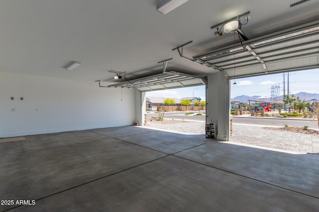 12358 W Marguerite Ave, Avondale, AZ 85323 - garage featuring a garage door opener and a mountain view