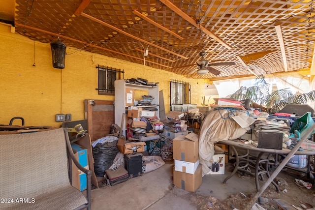 miscellaneous room with ceiling fan and concrete floors