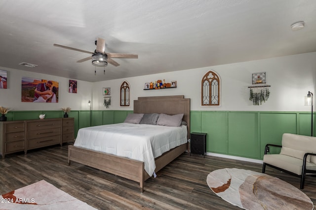 bedroom featuring ceiling fan and dark hardwood / wood-style flooring