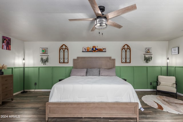 bedroom with ceiling fan and dark hardwood / wood-style floors