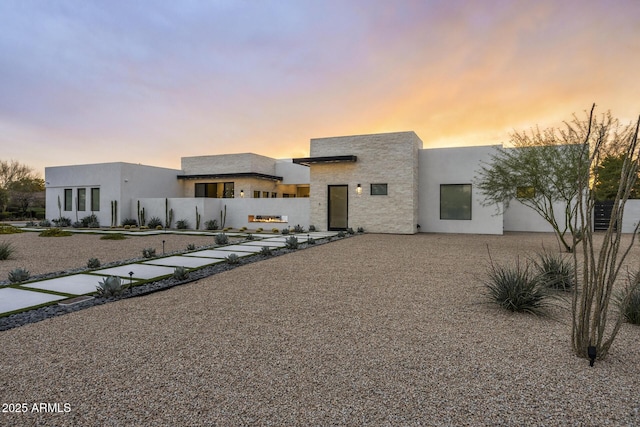 contemporary home featuring stucco siding