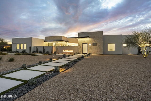 contemporary home featuring stucco siding