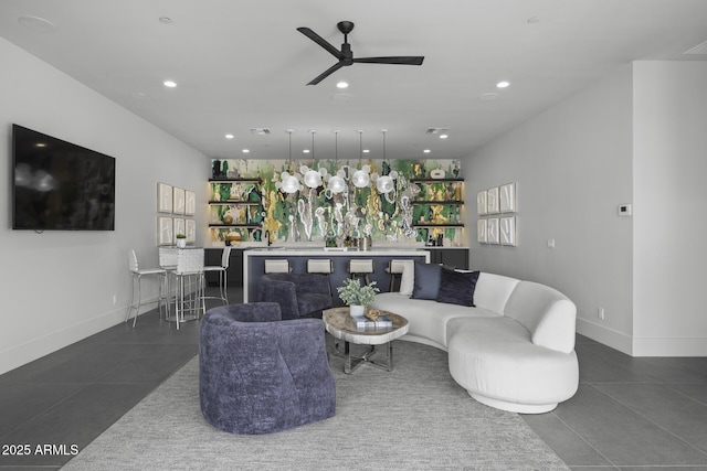 living room featuring dark tile patterned flooring, ceiling fan, and recessed lighting